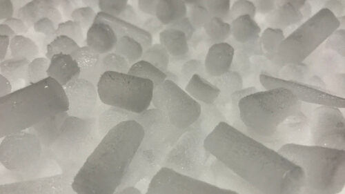 image is of a large pile of dry ice cube used for blasting surfaces.