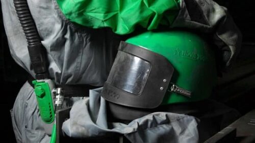 Black and green blasting protective gear