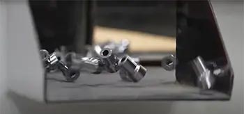 parts being processed through vibratory finishing